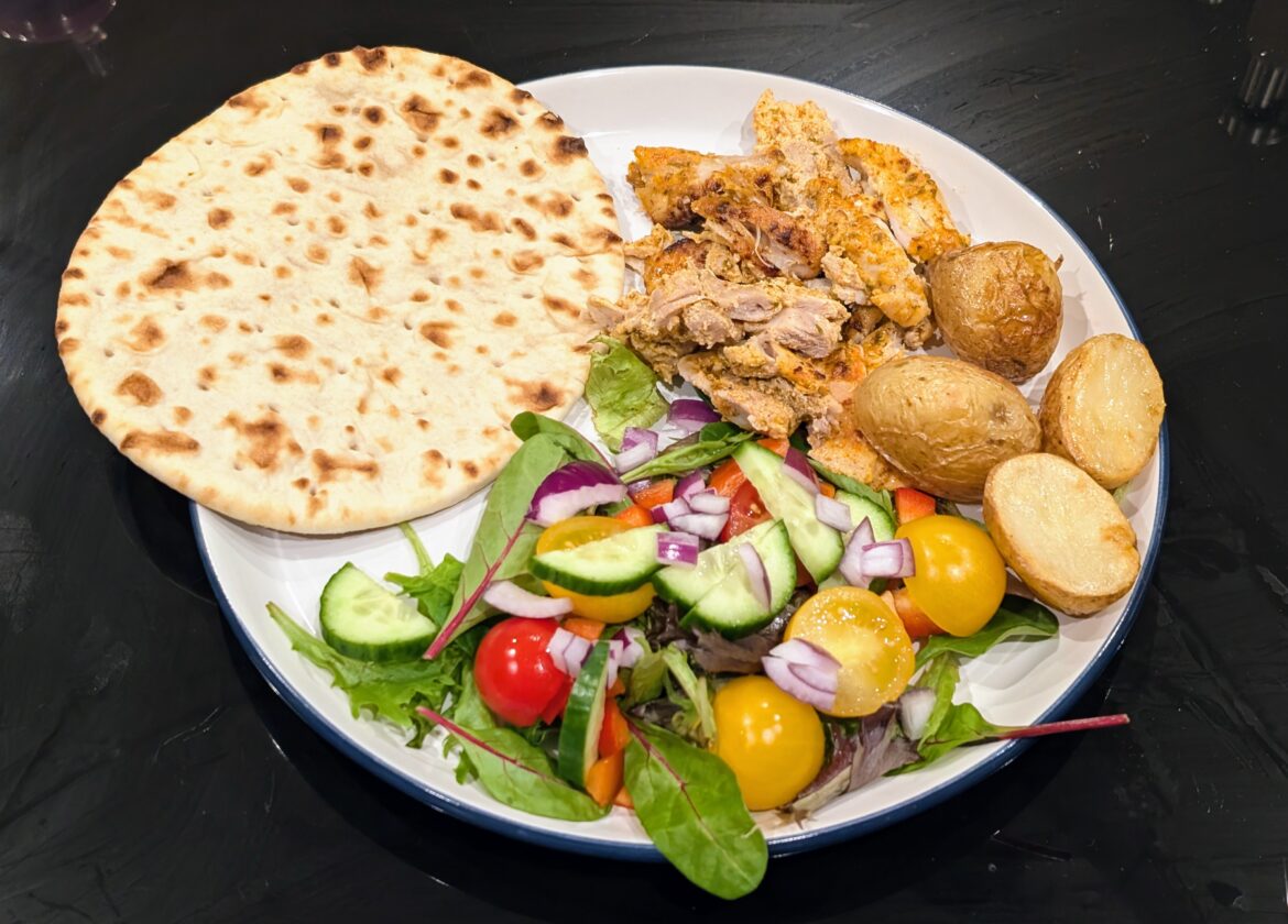 chicken gyros, salad, potatoes and flat bread