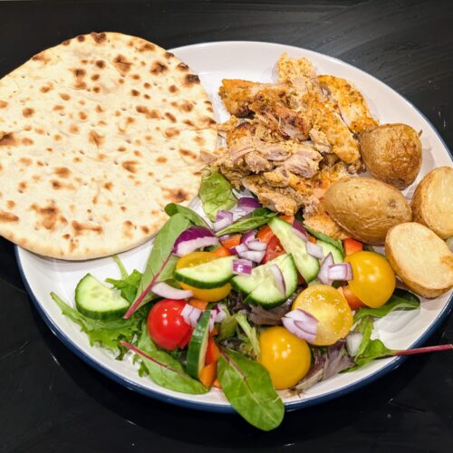 chicken gyros, salad, potatoes and flat bread