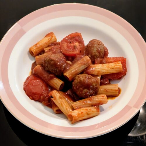 Meatballs and pasta in a bowl